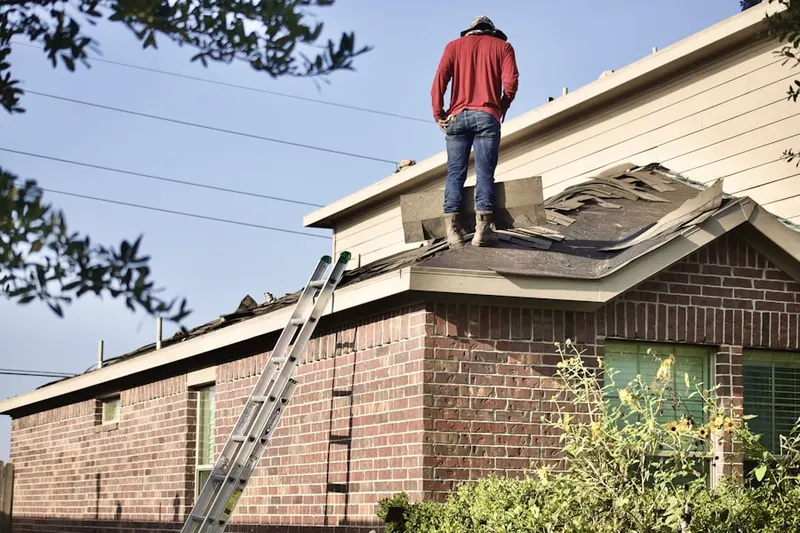 Professional roofer working on a residential roof in Dimond Oaks